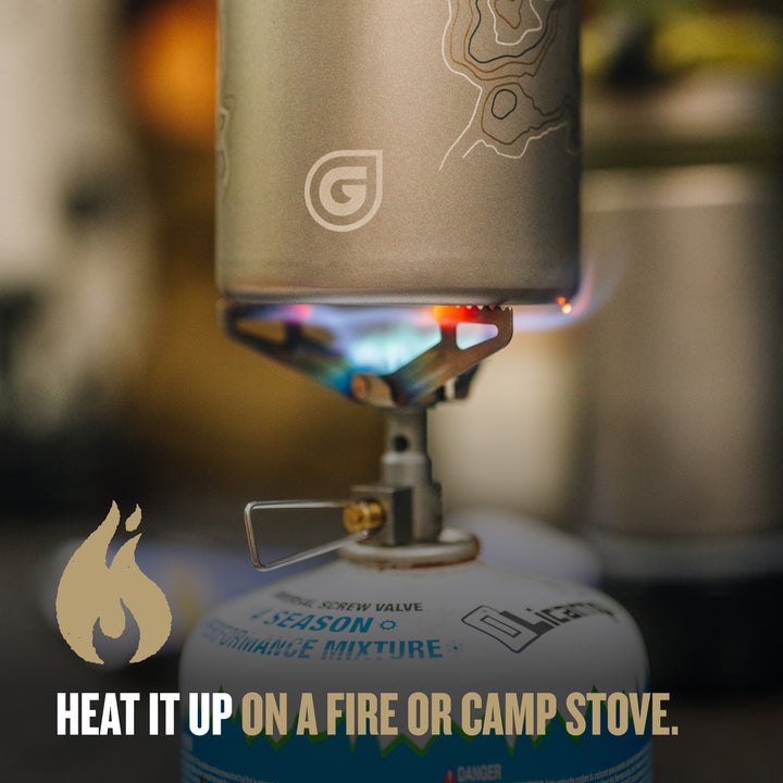 Heat up water on a fire or camp stove with the Ti Outer Cup