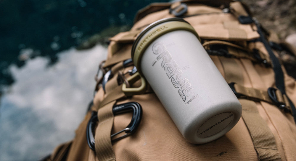 Camp cup on backpack in Guatemala.