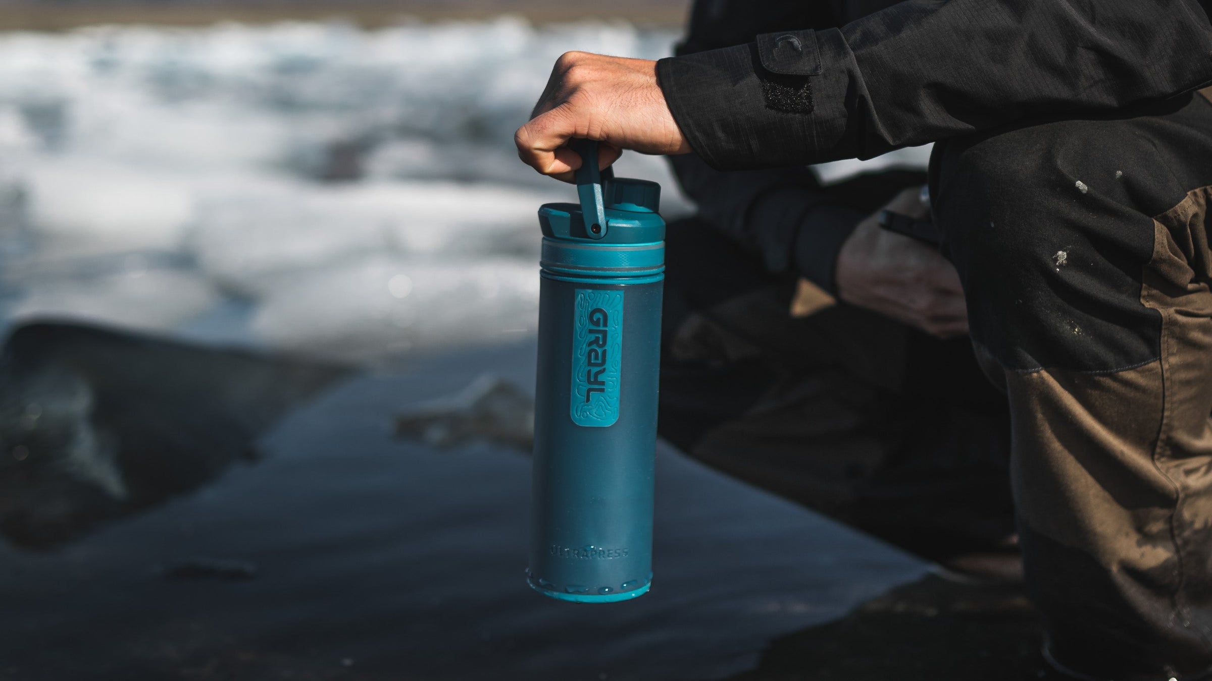 A Grayl UltraPress filter and purifier bottle pictured in Forest Blue colorway. Iceland.