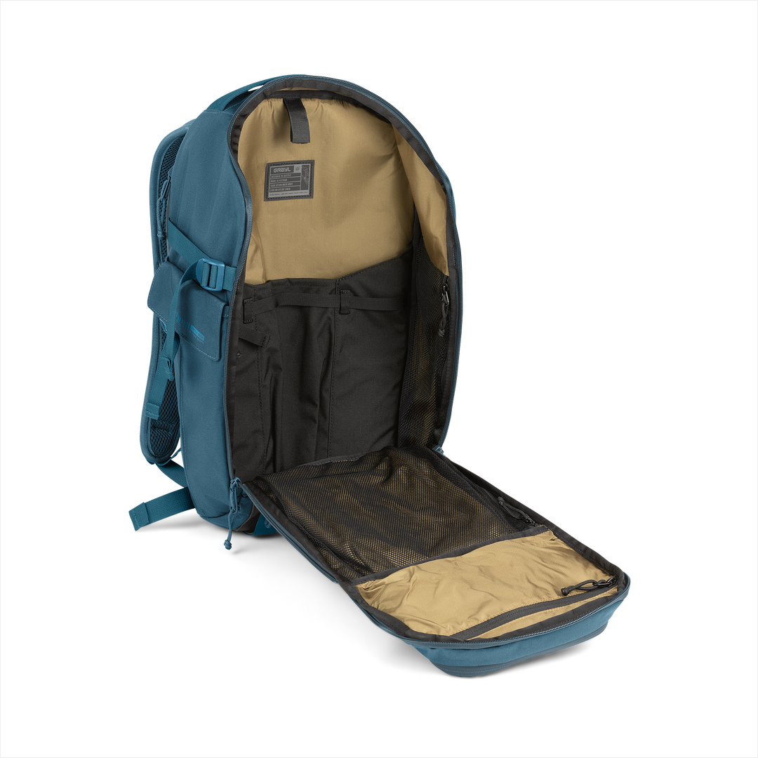 20L Mission Daypack (Wander Blue) with open compartment showing Coyote interior on a white background / Wander Blue
