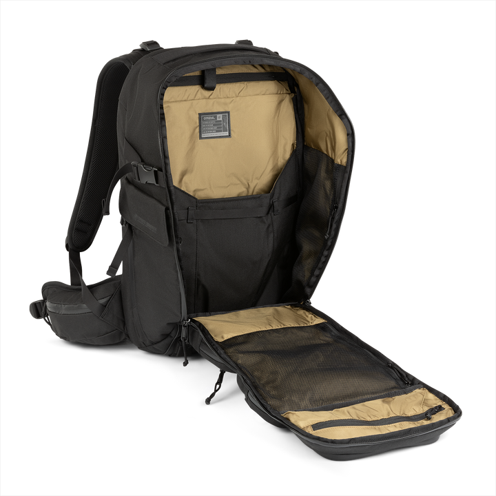 30L Mission Backpack (Covert Black) with open compartment showing Coyote interior on a white background / Covert Black