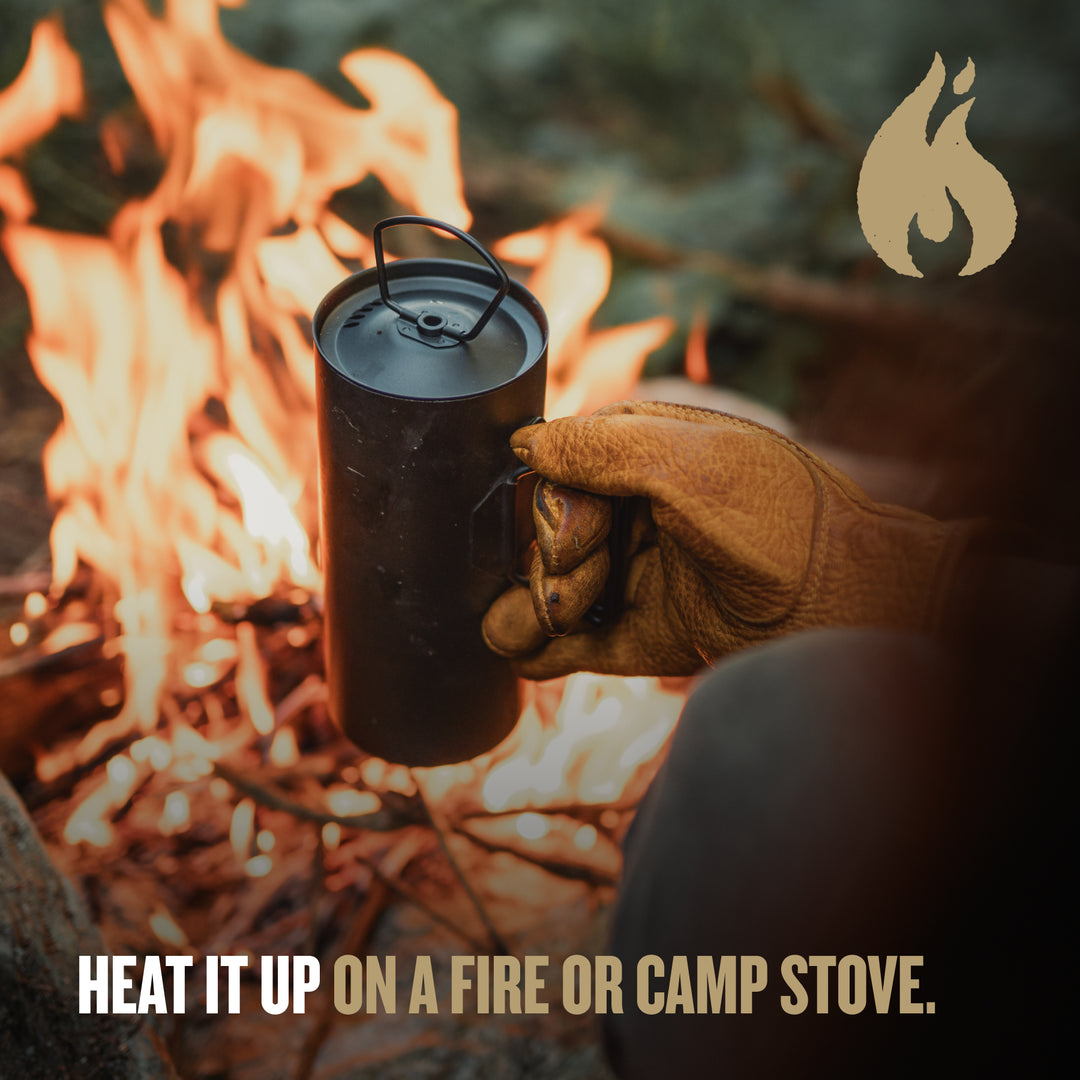 Heat it up on a fire of camp stove.