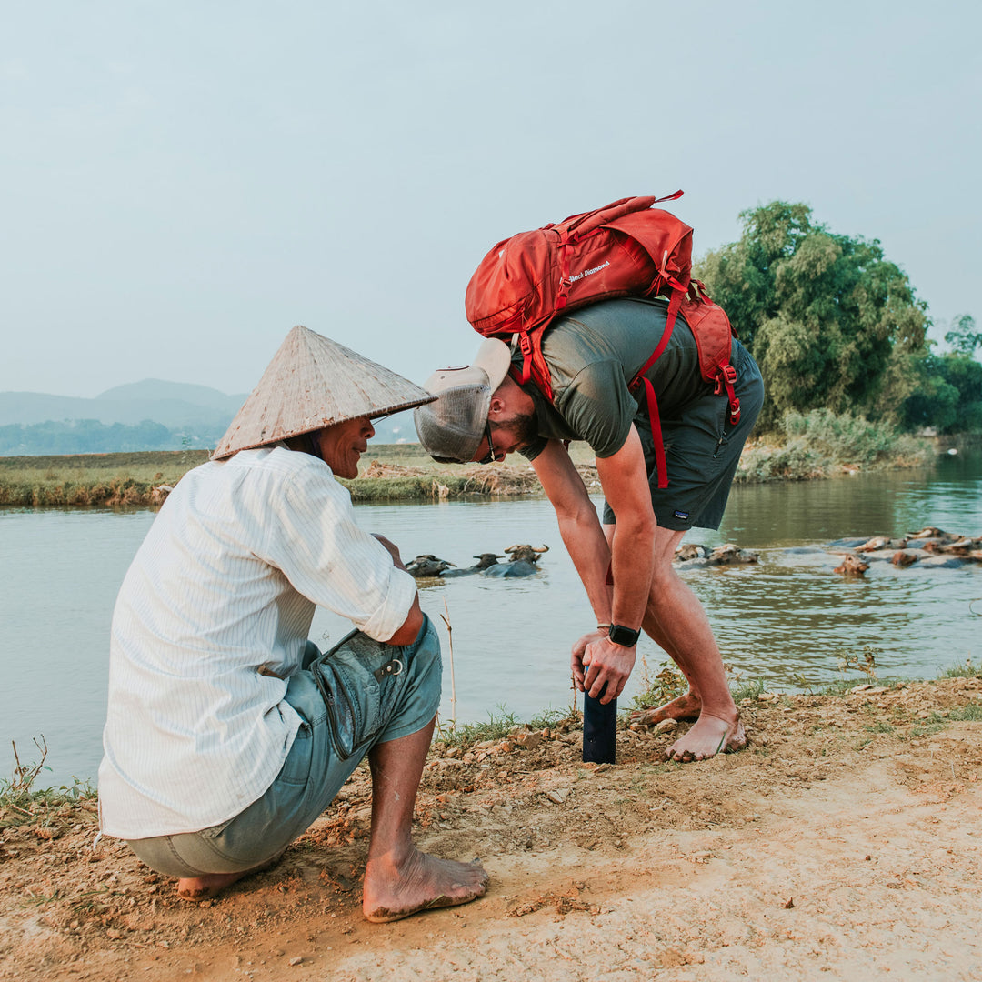 Grayl adventurer Kyle Murphy purifying water in Vietnam.
